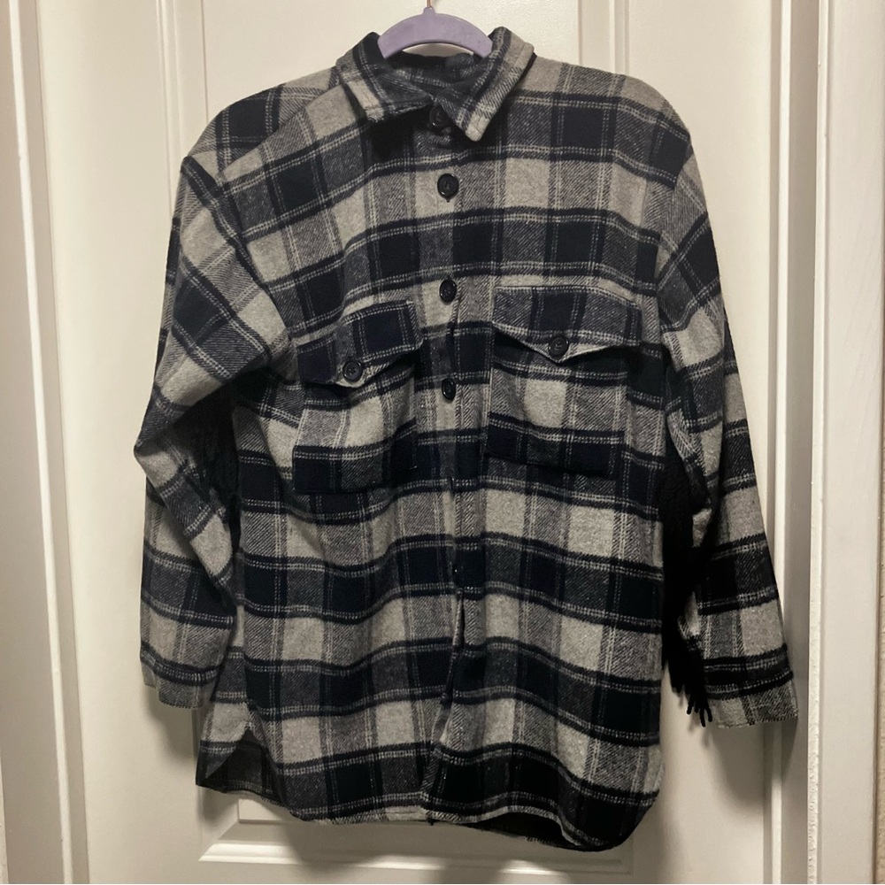 Pretty little thing women’s size small blue plaid Shacket with fringe on back